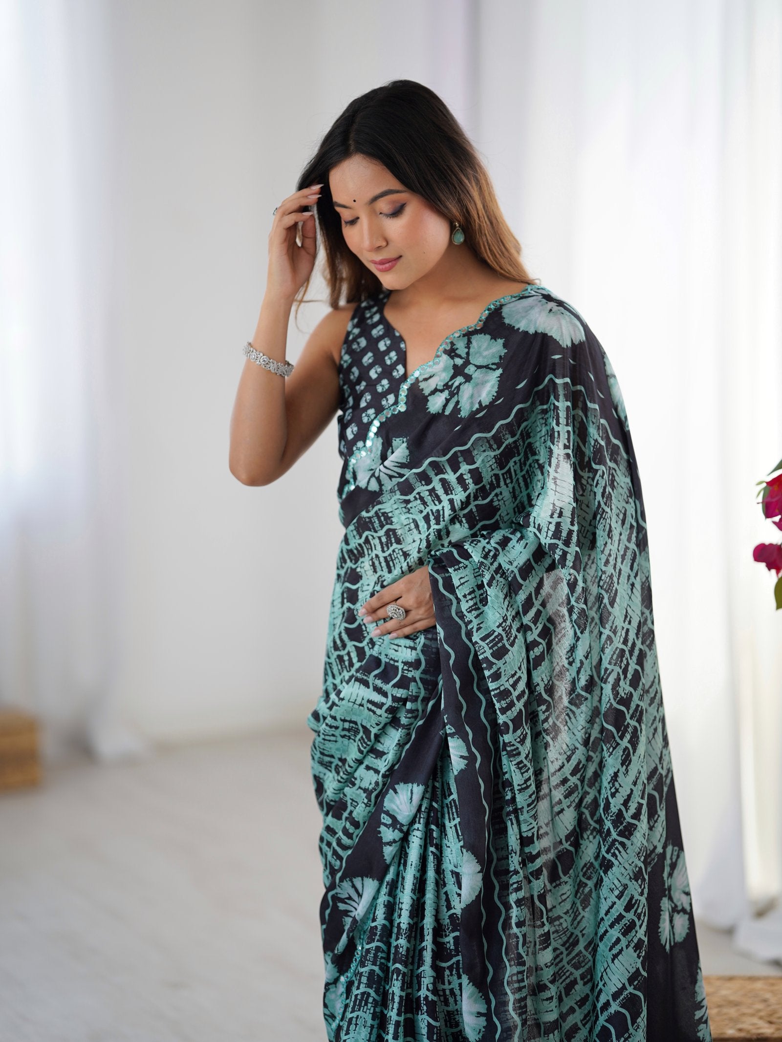 DVS-78 Black & Teal Chinnon Saree with Kutchi Mirror Lace Border